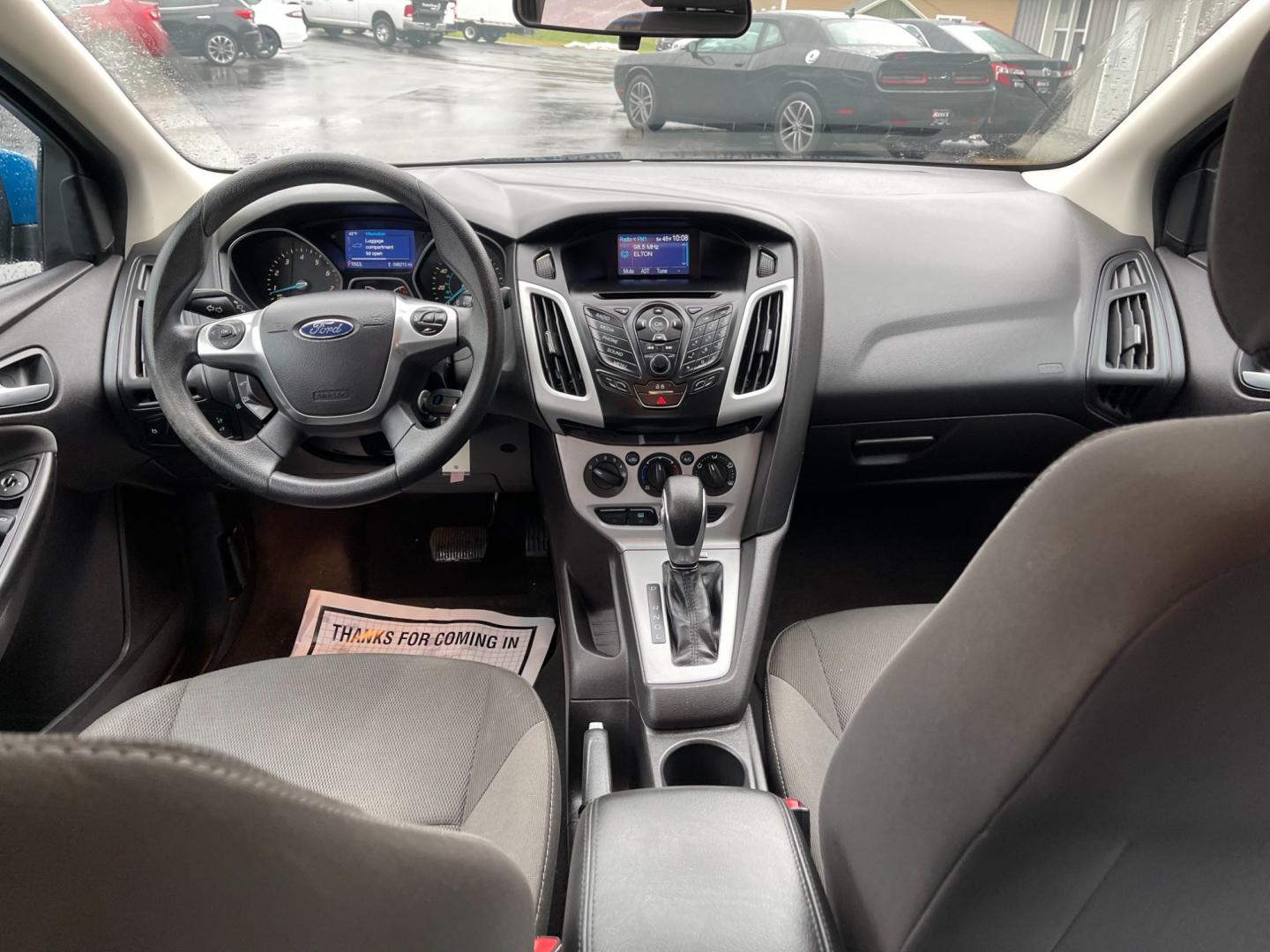 2014 Blue /Black Ford Focus SE Sedan (1FADP3F2XEL) with an 2.0L I4 DOHC 16V FFV engine, 6-Speed Automatic transmission, located at 547 E. Main St., Orwell, OH, 44076, (440) 437-5893, 41.535435, -80.847855 - Photo#33